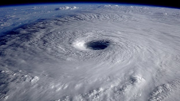 Powerful Hurricane Swirling Over the Ocean with Distinct Eye and Dramatic Cloud Formation Captured from Space photo