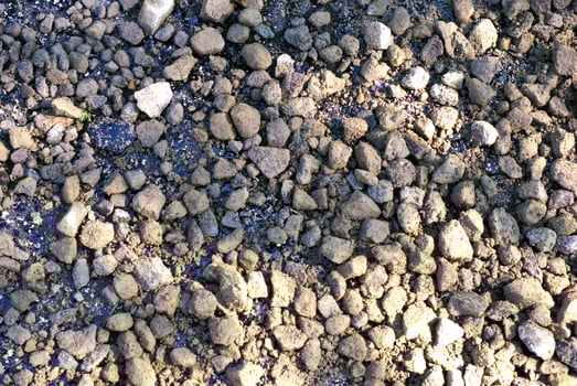 Abstract image of gravel stones on a road construction photo