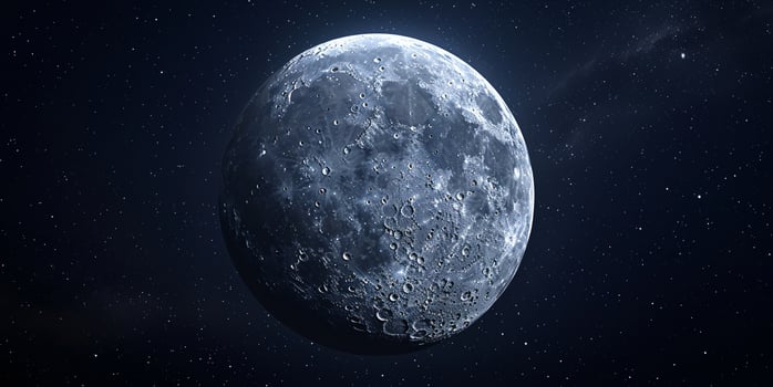 A large, round, blue moon in the night sky photo