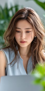 Young woman focused on her work in a bright space photo