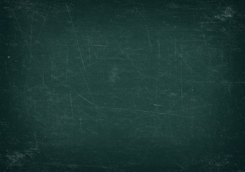 Dark green chalkboard with scratches. Texture of a school board with traces of chalk. Grunge surface for text, graphics, and design. Vintage style background. photo