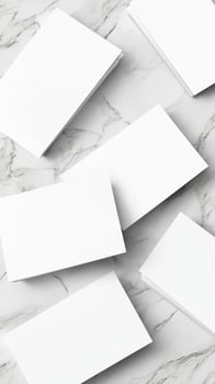 White Blank Business Cards Scattered on a Marbled Surface with Soft Lighting photo