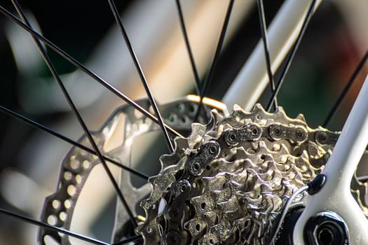 detail of bike cassette sprockets and wheel spokes, cycling mechanics close view of bike rear wheel photo