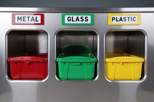 Modern Metal, Glass and Plastic Color-Coded Recycling Bins with Red, Green and Yellow Containers in Stainless Steel Frame, Environmental Waste Sorting System with Clear Labeled Compartments photo