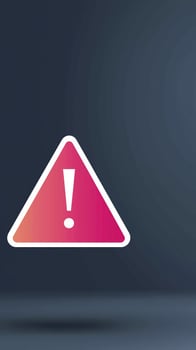 A pink triangle with an exclamation mark on it photo