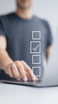 Man using laptop with check mark on screen photo