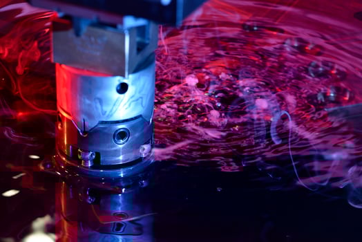 close up view of the machine working on liquid with red and blue illumination photo
