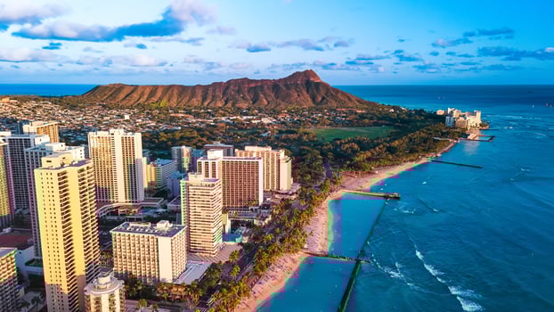 Panorama of Waikiki at the shore of the Pacific Ocean. Aerial perspective on the Diamond Head Crater and blue ocean waterscape. photo