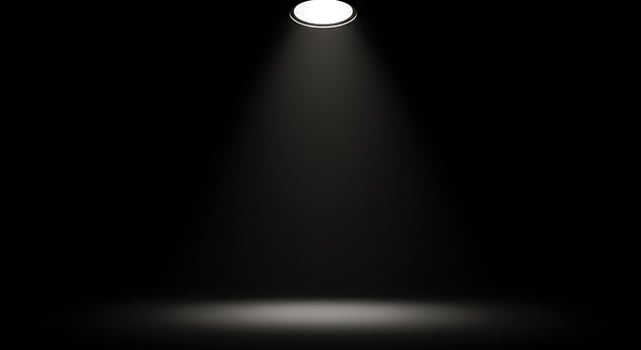 A spotlight is shining on a black background photo