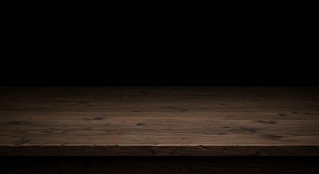Wooden table with black background photo