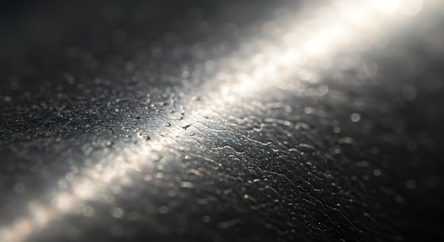 A close up of a shiny metal surface photo