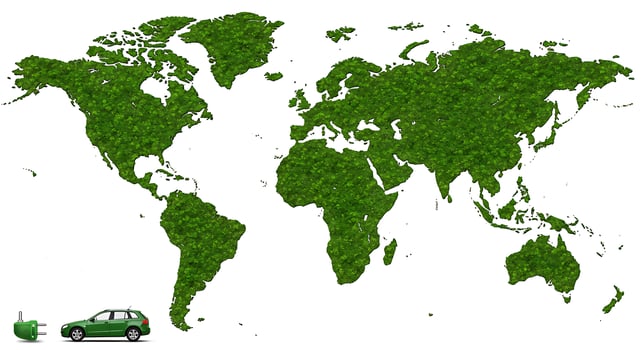 Green car on a map of the world photo