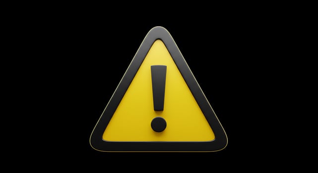 A yellow warning sign with an exclamation mark on it photo
