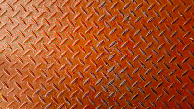 Red steel corridor an orange diamond plate with a pattern on it photo