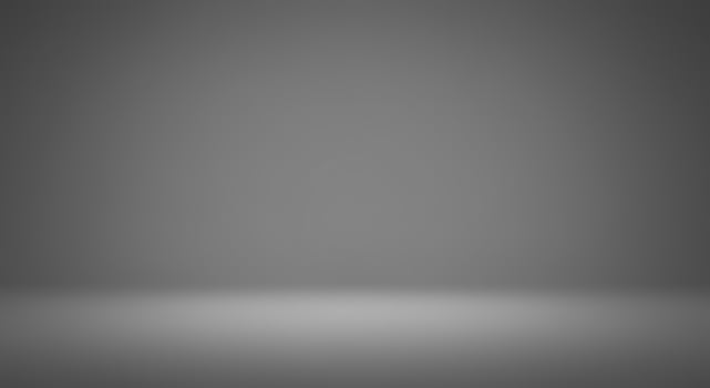 A black and white photo of a room with a light