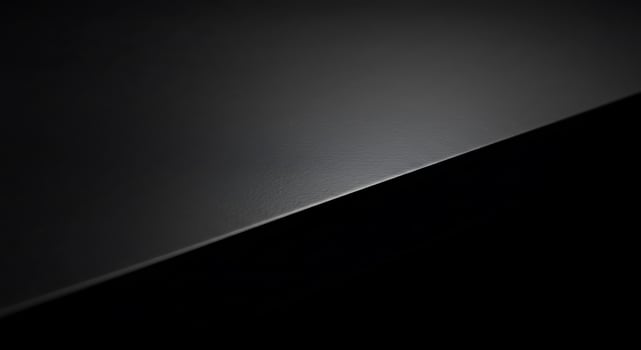 A black surface with a dark background photo