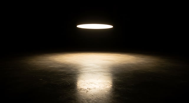 A light shining on a dark floor photo