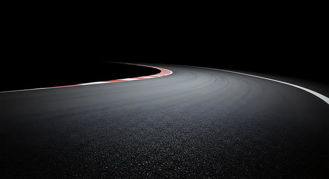 An empty road at night with a white line photo