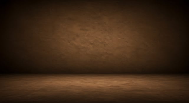 An empty room with a dark wall and a light floor photo
