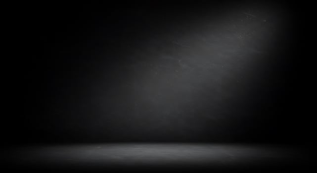 Empty black room with spotlight and light photo
