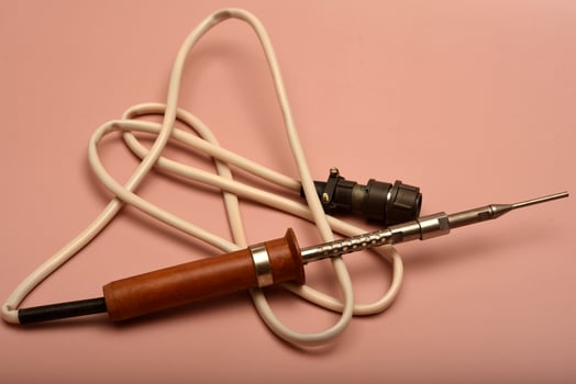 An antique soldering gadget showcasing a silver-coated end photo