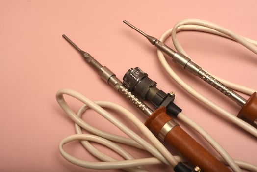 A weathered soldering device boasting a silver end photo