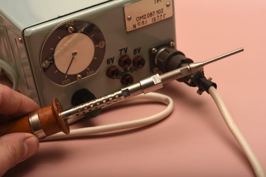 Retro soldering station. old soldering iron with a silver tip. photo