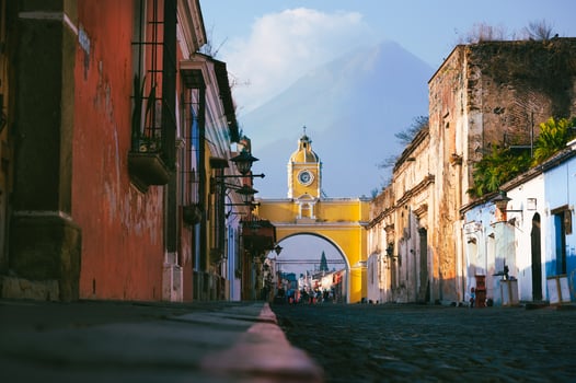 Santa Catalina Arch and volcano view in Antigua Guatemala photo