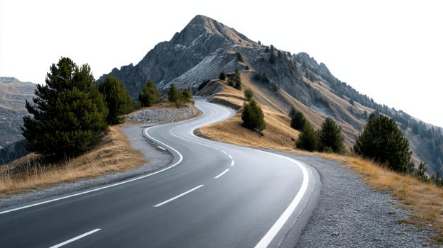 Scenic Mountain Road Winding Through Majestic Peaks photo