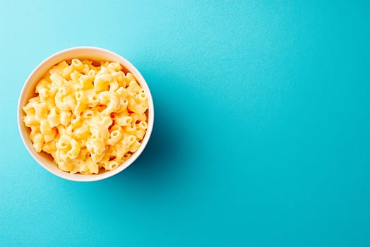 Top View Of Family-Sized Macaroni And Cheese On Vibrant Background With Copy Space, Food Setting photo