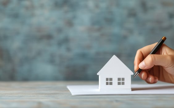 Property Investment A Miniature Home, Representing Future Plans and Real Estate Deals photo