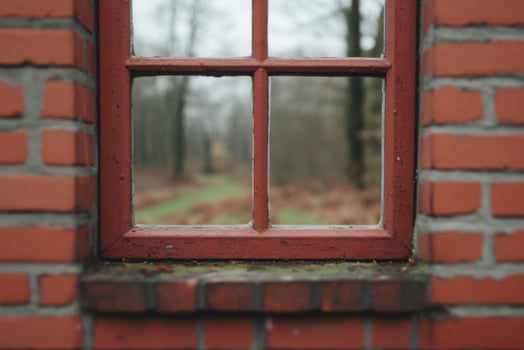 Rustic Red Brick Wall with a Vintage Window View of a Forest photo