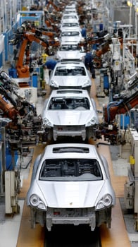 A factory with cars on the assembly line photo