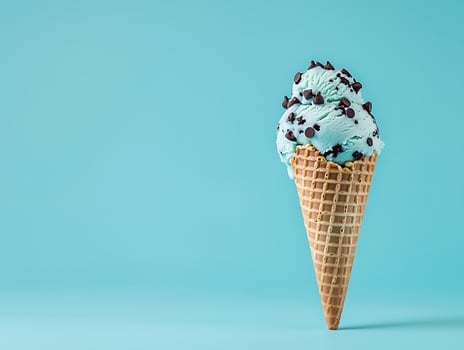 Mint chocolate chip ice cream in a waffle cone photo