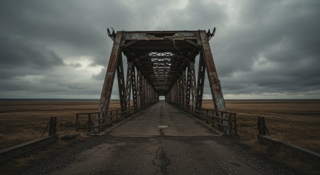 Distant horizons over weathered bridge on cloudy desolate landscape photo