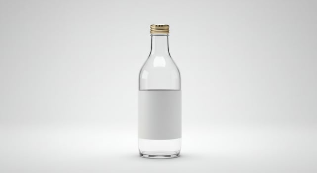 Elegant clear glass bottle with blank label and golden cap, isolated view photo