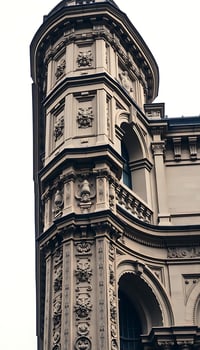 tall building with a clock on it's side photo