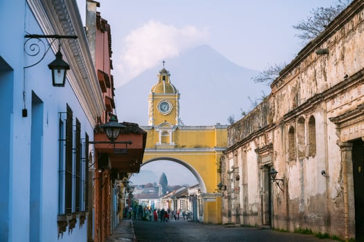 Antigua Guatemala sunrise with Santa Catalina Arch and volcano photo