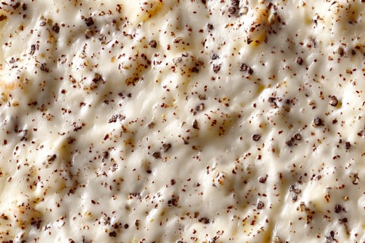 Cream with chocolate crumbs as a background. Macro. photo