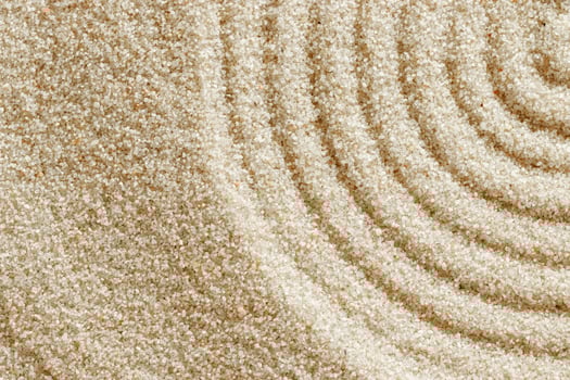 Smooth simple Lines on sand background, minimal aesthetic sandy texture. Spa, meditation, relaxation, wellness concept. Natural beige waves pattern in Japanese zen garden. View from above photo