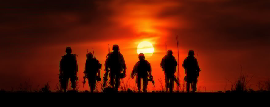 Brave soldiers silhouetted against fiery sunset veteran tribute photo
