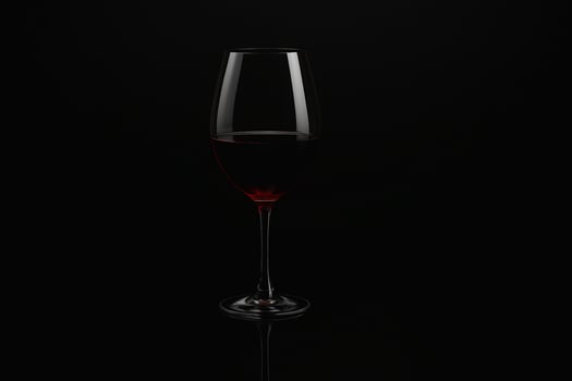 Glass of Red Wine on Black Background with Elegant Lighting photo