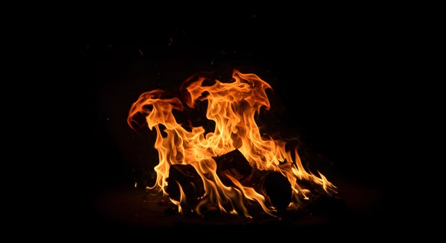 Burning Fire at night with dark background photo