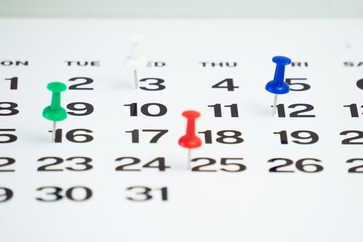 calendar and red reminder pin sign photo