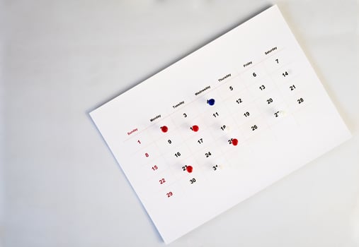 deadline concept with push pin on calendar date photo