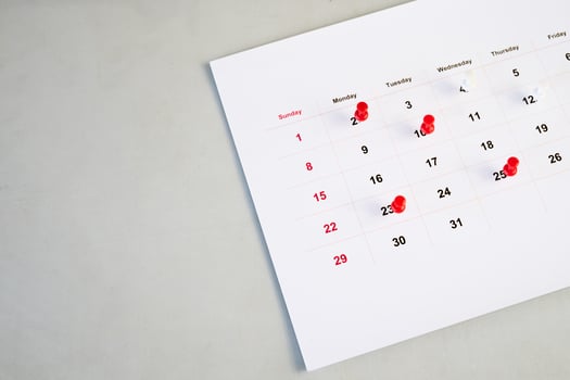 background of calendar and red push pin photo