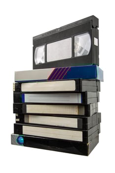 Vintage VHS Tape Collection with Handwritten Tags photo