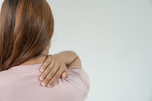 woman working in office with a carpal tunnel syndrome or wrist joint inflammation, hand muscle inflammation from office syndrome , hand muscle pain from worki photo