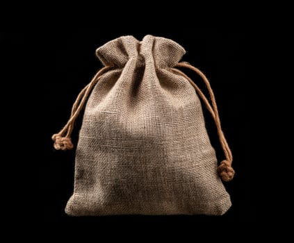 Natural burlap bag for gift wrapping or storage purposes photo
