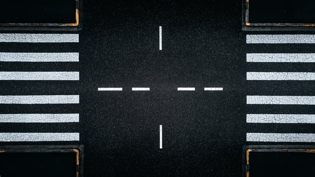 Aerial view of crosswalk pedestrian crossing road marking asphalt texture photo